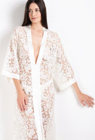 Discover the 2026 Cruise collection of lingerie couture from the house Carine Gilson with this long v neck kaftan in natural silk  with natural lace