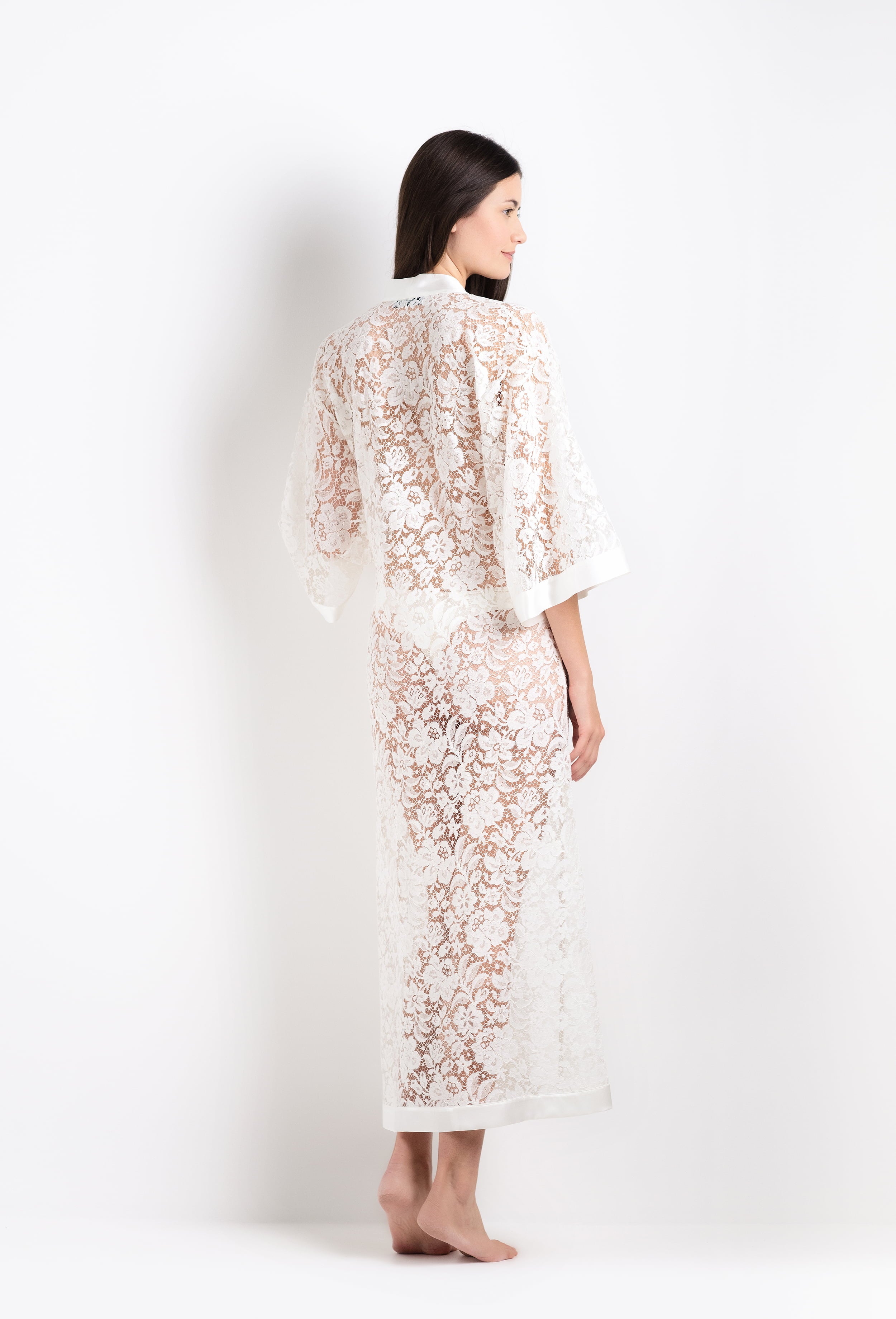 Discover the 2026 Cruise collection of lingerie couture from the house Carine Gilson with this long v neck kaftan in natural silk  with natural lace