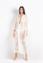 Discover the 2026 Cruise collection of lingerie couture from the house Carine Gilson with this long v neck kaftan in natural silk  with natural lace