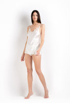 Enjoy the 2026 Cruise collection of lingerie couture from the house Carine Gilson with this camisole v neckline in natural silk  with natural lace