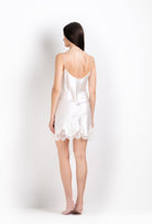 The 2026 Cruise collection from the house Carine Gilson - The most beautiful couture lingerie to be discovered with this slip babydoll style v neckline in natural silk  with natural lace