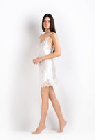 The 2026 Cruise collection from the house Carine Gilson - The most beautiful couture lingerie to be discovered with this slip babydoll style v neckline in natural silk  with natural lace