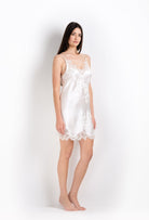 The 2026 Cruise collection from the house Carine Gilson - The most beautiful couture lingerie to be discovered with this slip babydoll style v neckline in natural silk  with natural lace