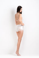 Discover the 2026 Cruise collection of lingerie couture from the house Carine Gilson with this soft triangle bra in natural silk  with natural lace