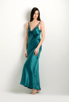 Enter Carine Gilson's world and the most beautiful silk lingerie with the 2024 winter collection and this Long Gown V Neckline in blue Silk with emerald green lace