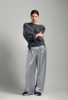 Discover the unique craftmanship of the belgian designer Carine Gilson in her atelier for the Winter 2026-27 collection with this oversize jumper in stormgrey