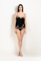 Discover the unique craftmanship of the belgian designer Carine Gilson in her atelier for the 2025 Winter collection with this Camisole V Neckline in Black Silk  with Vison lace