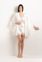 Made of silk and lace, explore the lingerie collection 2025 Summer from the house Carine Gilson with this Short Kimono Butterfly Sleeves in Natural Silk  with Natural lace