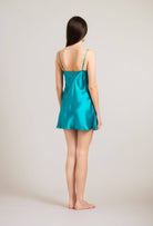 Discover the 2024 summer collection of lingerie couture from the house Carine Gilson with this silk Slip Babydoll Style in Emerald green with natural lace