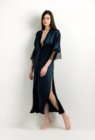 Discover the unique craftmanship of the belgian designer Carine Gilson in her atelier for the 2024 winter collectionLong V Neck Kaftan in dark blue Silk with Black lace