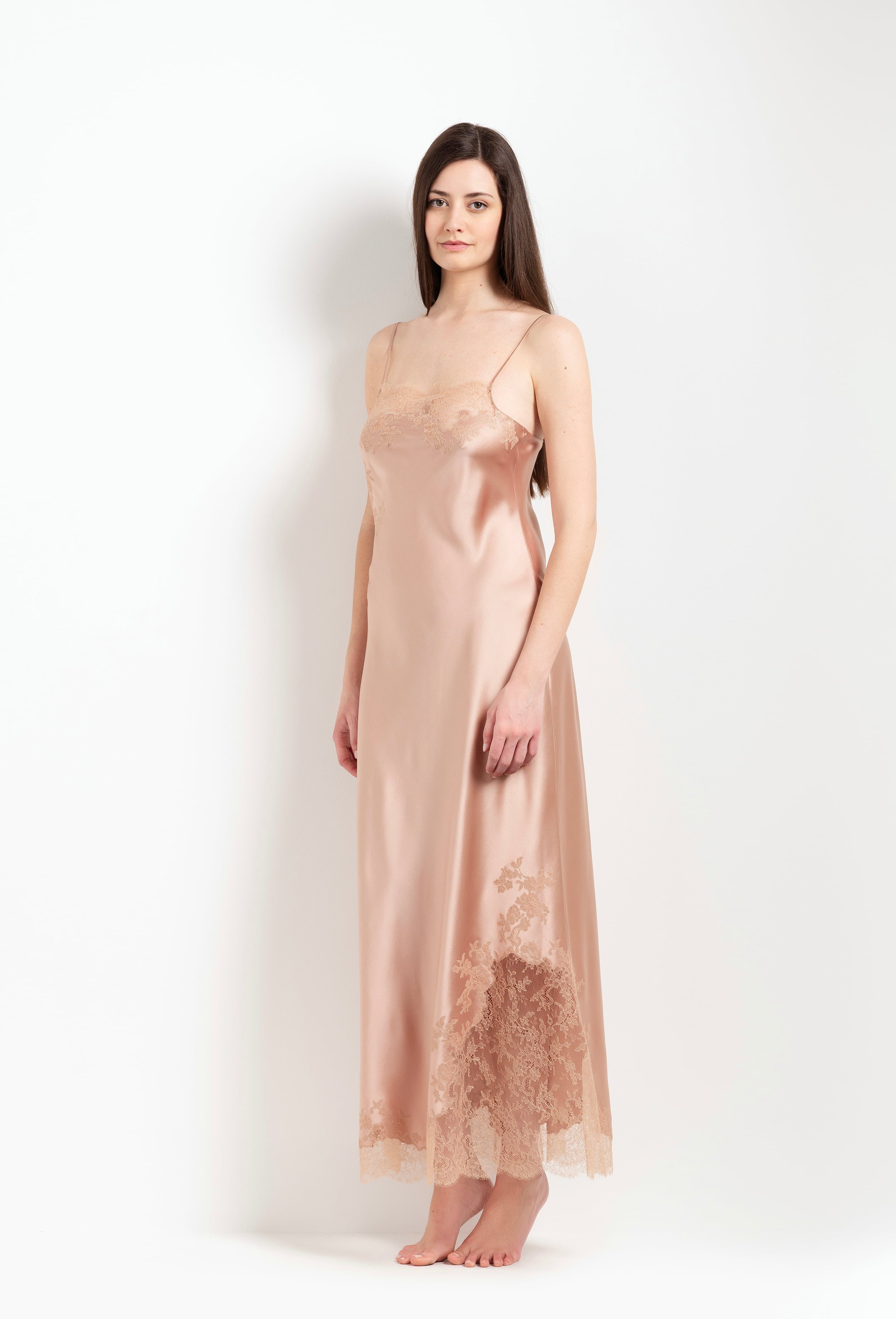 Discover the unique craftmanship of the belgian designer Carine Gilson in her atelier for the Winter 2026-27 collection with this Long Dress Straight Neckline in Beige vison Silk  with Beige vison lace