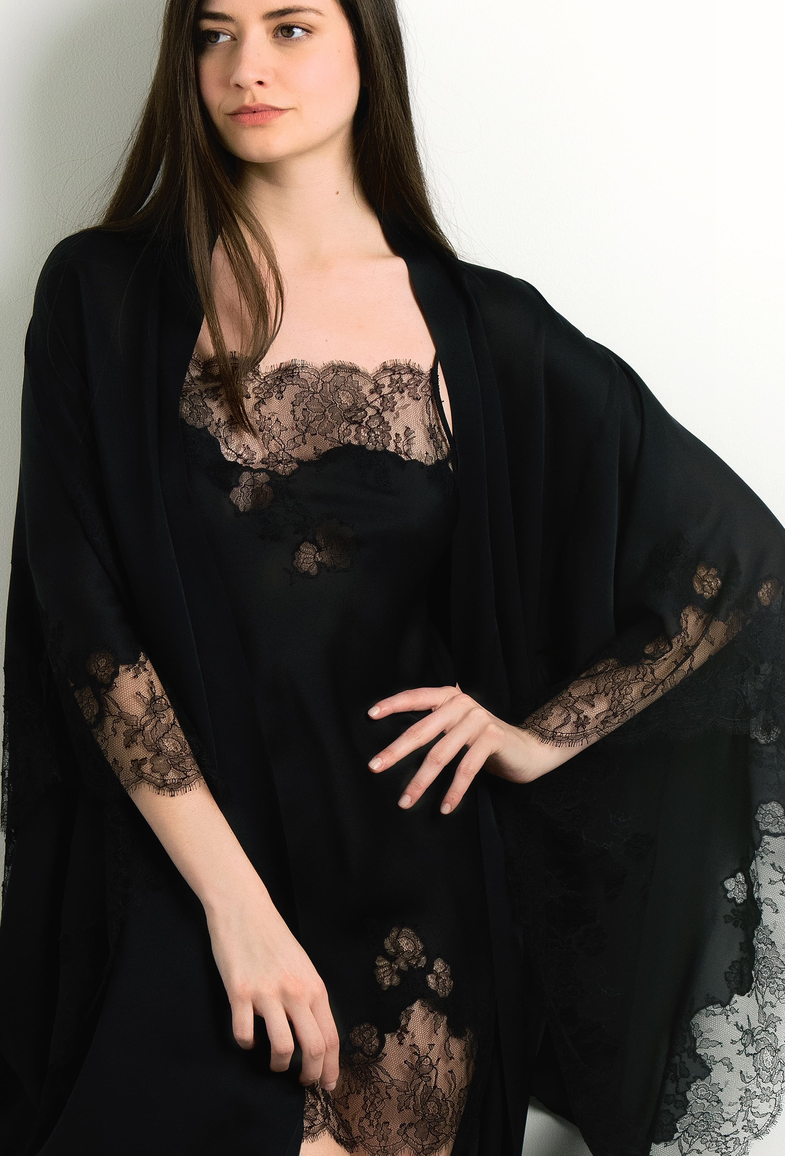 Discover the unique craftmanship of the belgian designer Carine Gilson in her atelier for the 2024 winter collectionSlip Babydoll Style Straight Neckline in Black Silk with Black lace