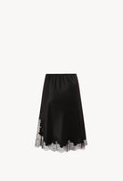 Discover the unique craftmanship of the belgian designer Carine Gilson in her atelier for the Winter 2026-27 collection with this Skirt in black Silk  with black lace