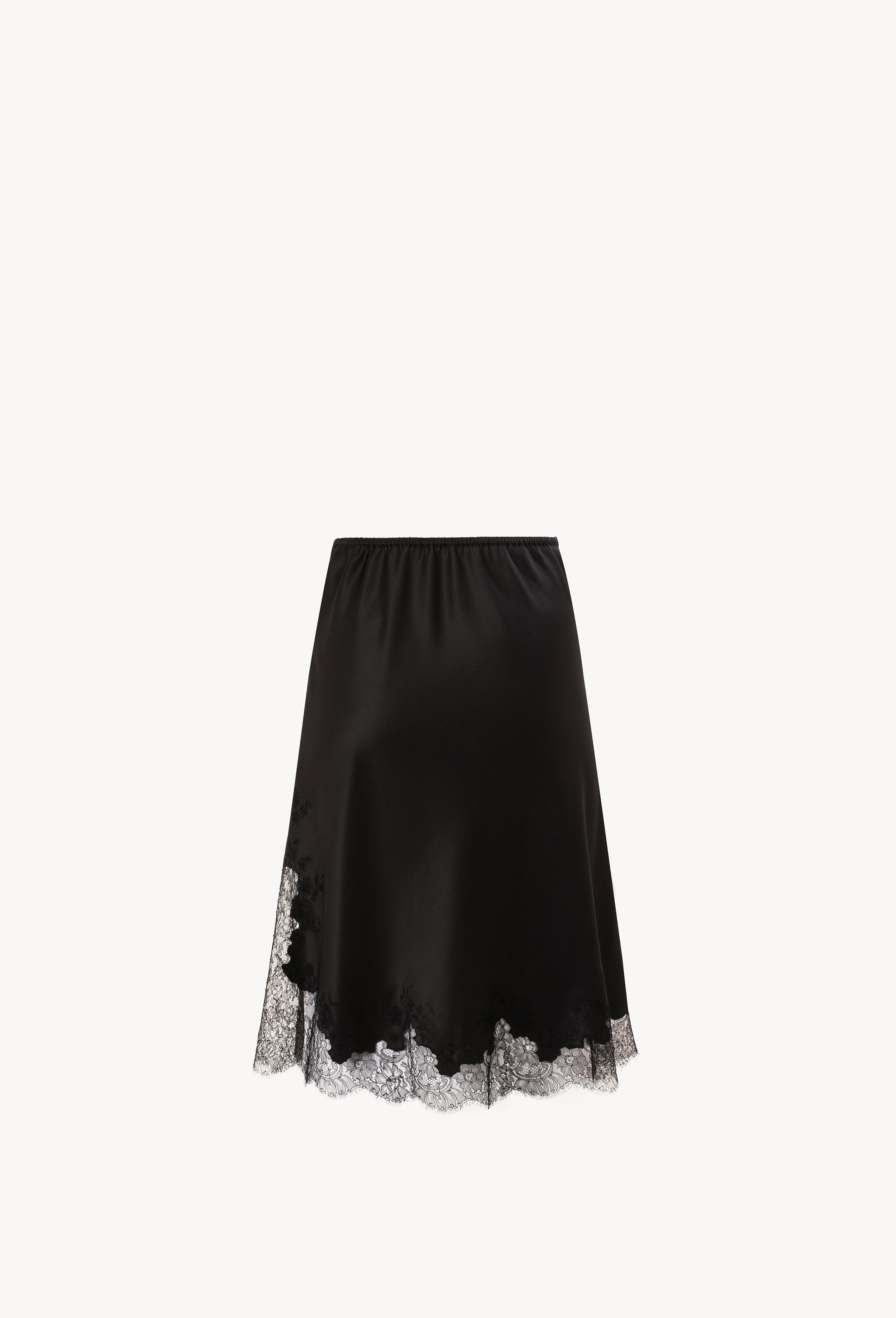 Discover the unique craftmanship of the belgian designer Carine Gilson in her atelier for the Winter 2026-27 collection with this Skirt in black Silk  with black lace