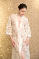 Discover the 2026 Cruise collection of lingerie couture from the house Carine Gilson with this long v neck kaftan in natural silk  with natural lace