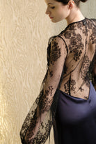 Discover the unique craftmanship of the belgian designer Carine Gilson in her atelier for the 2026 Cruise collection with this Long Déshabillé Cache-Coeur Style Silk Satin in Dark Marine Blue Silk  with black lace